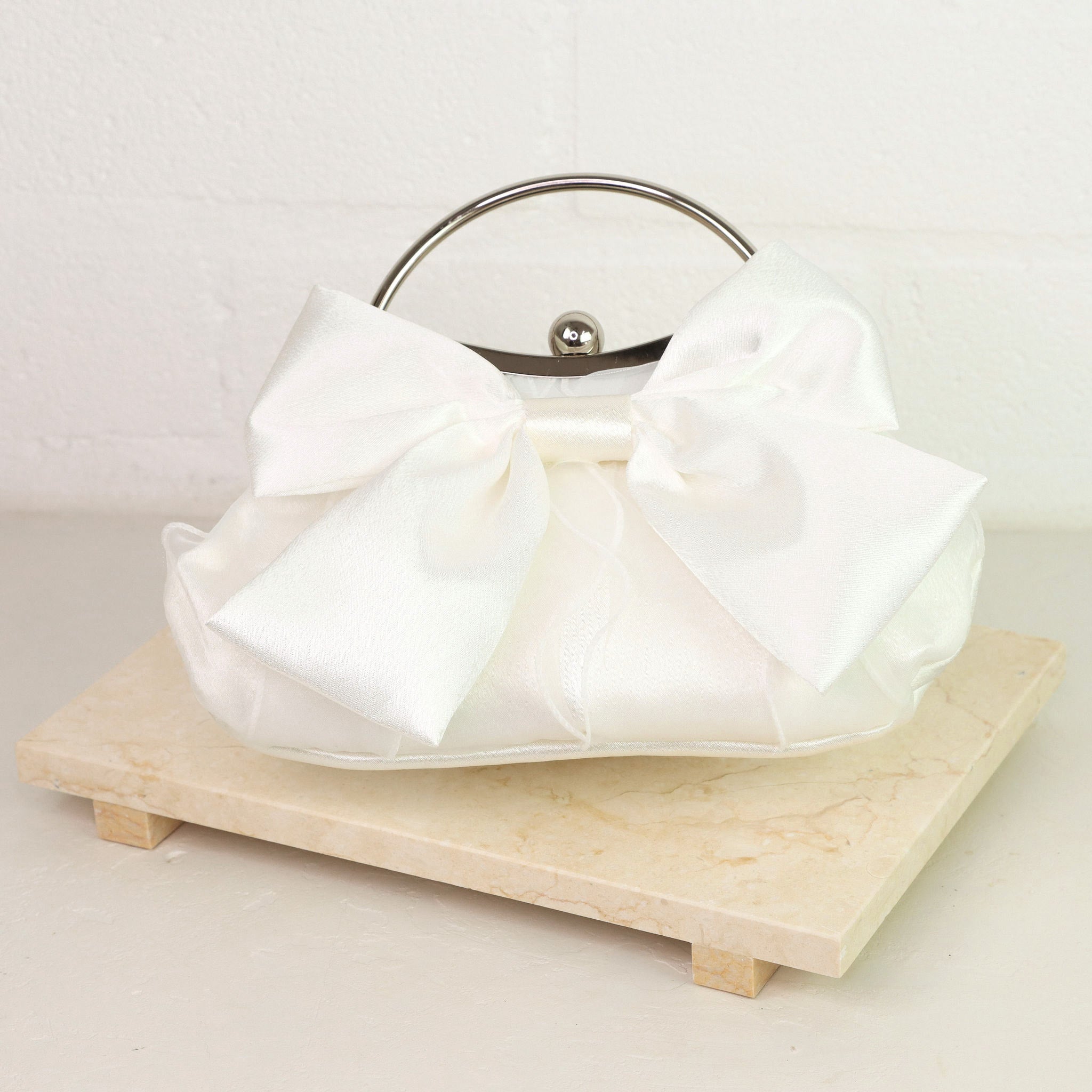 White bow clutch discount bag