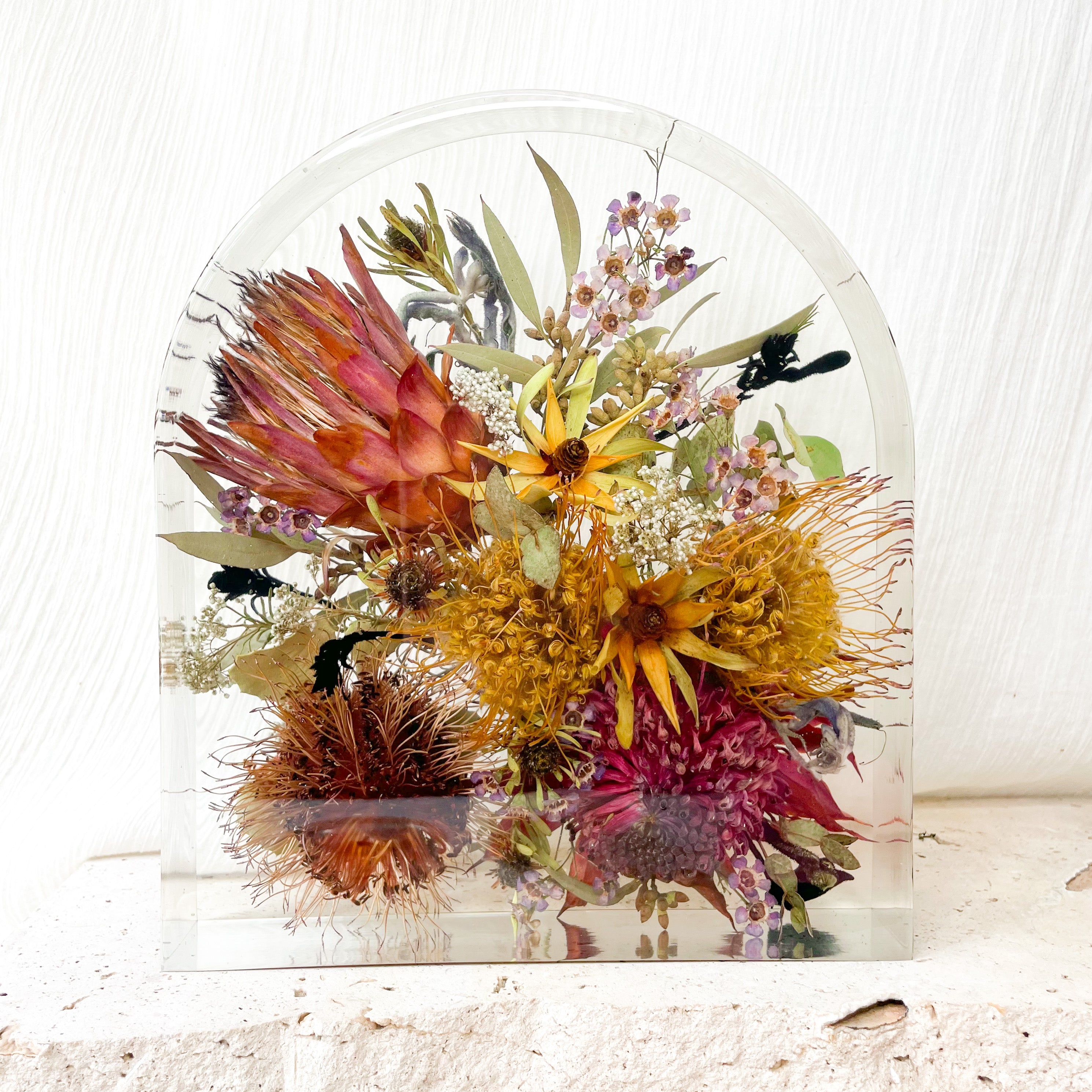 Bright native wedding bouquet preserved in extra large resin arch