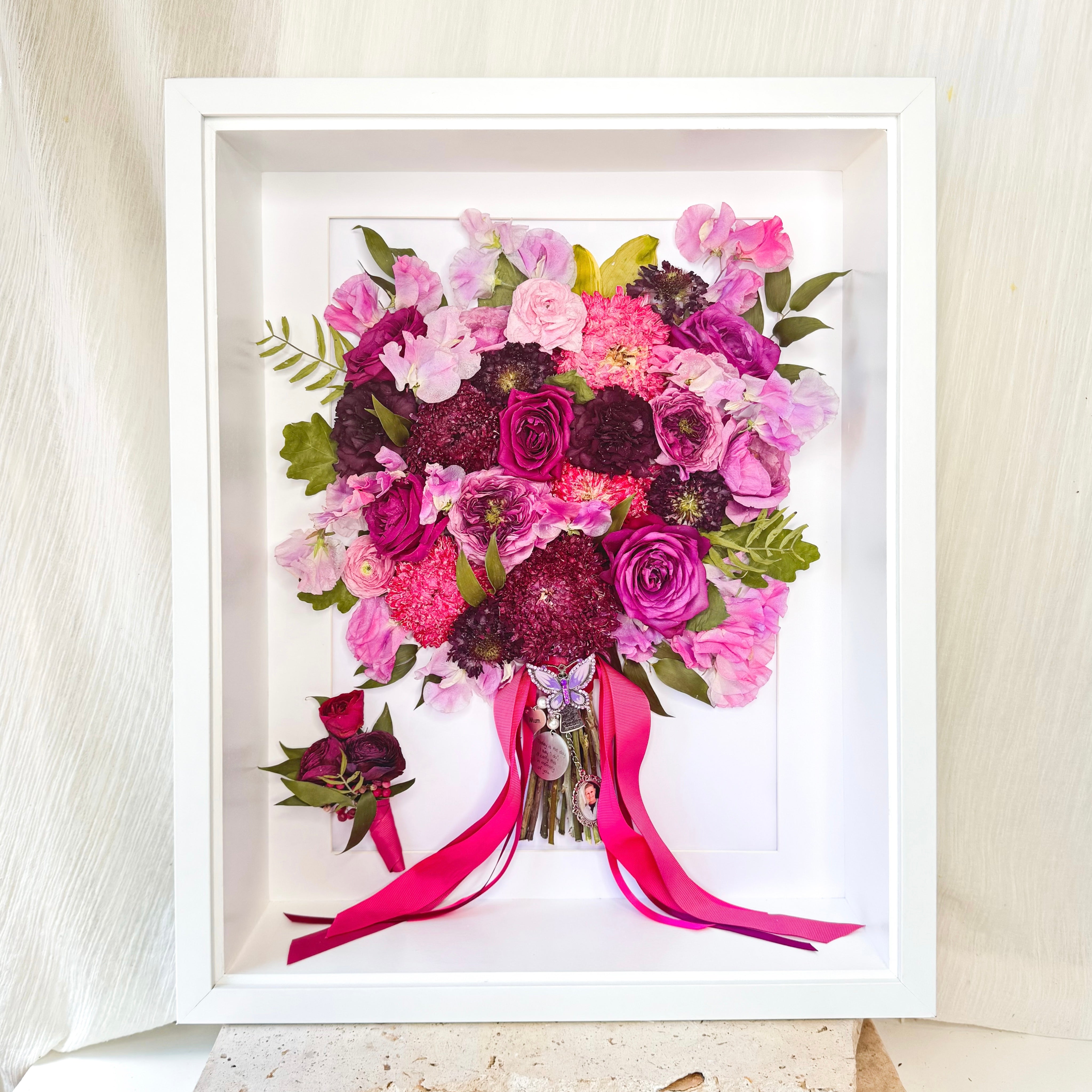 custom-flower-framing-3d-shadow-box
Preserved pink purple wedding bouquet and buttonhole set in 40x50cm white 3d frame - memorial charms
