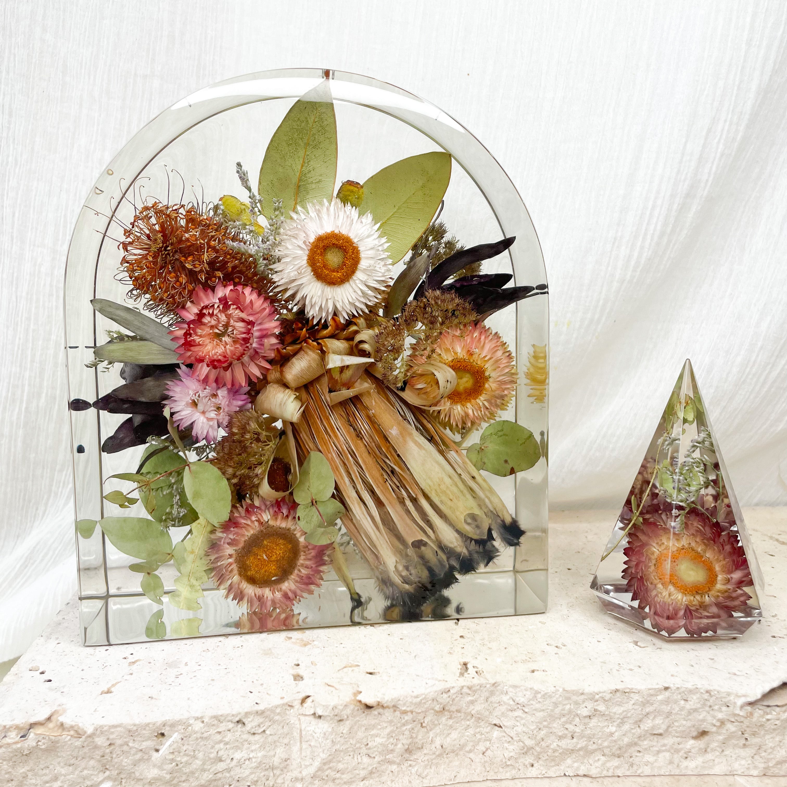 Preserved native wedding flowers in large resin arch