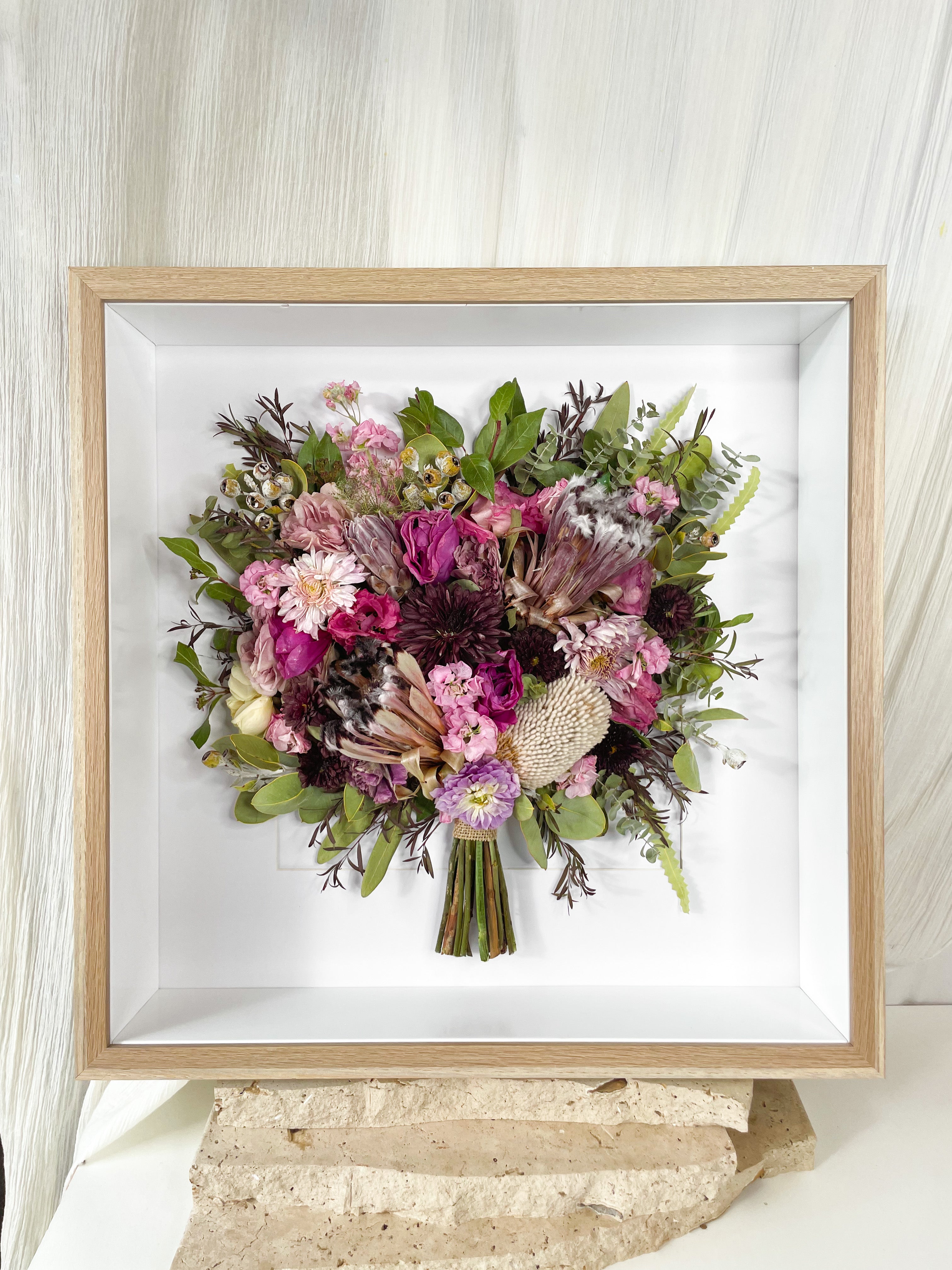 custom-flower-framing-3d-shadow-box
Preserved native pink purple wedding bouquet set in 50x50cm 3d oak frame