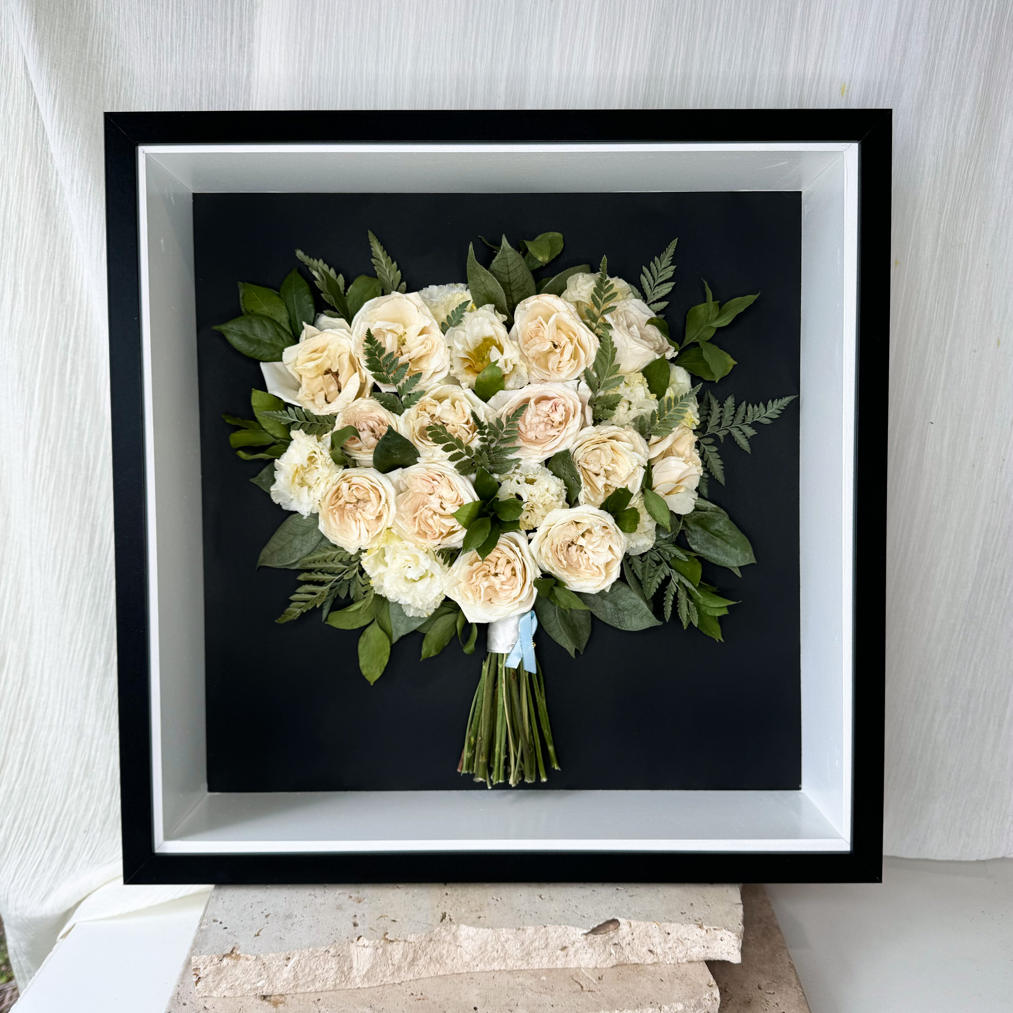 custom-flower-framing-3d-shadow-box
Preserved white rose greenery wedding bouquet set in 50x50cm frame with black mat board