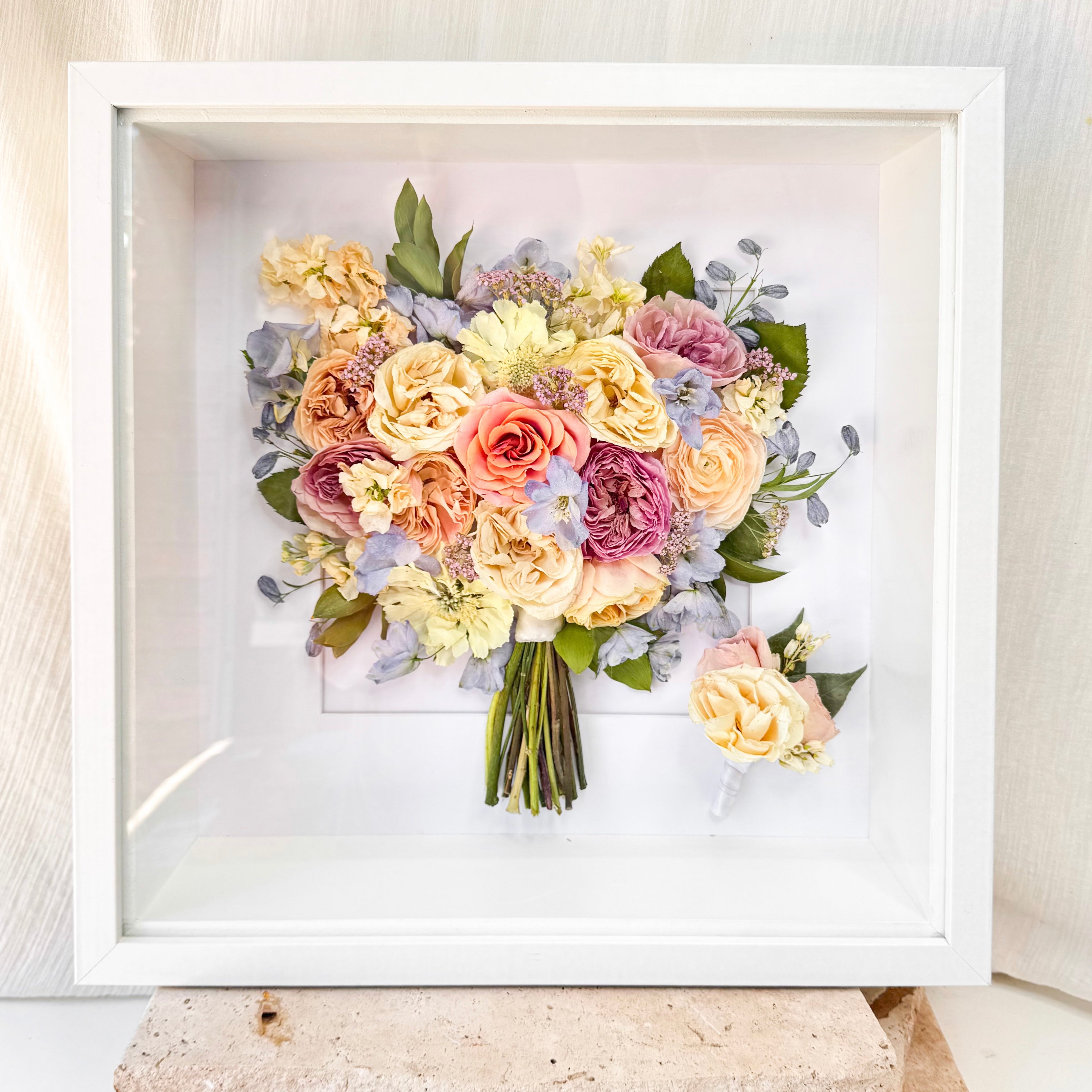 custom-flower-framing-3d-shadow-box
Preserved spring pastel wedding bouquet set in 50x50cm 3d white frame with buttonhole