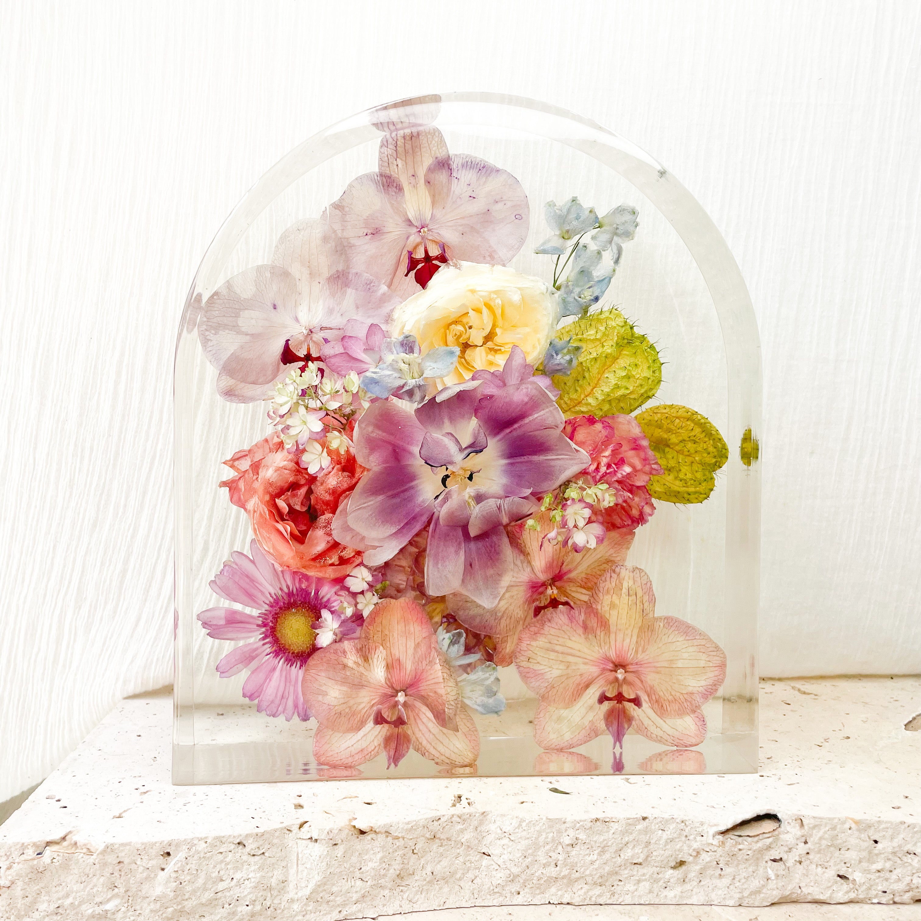 Colourful preserved wedding flowers in extra large arch resin block