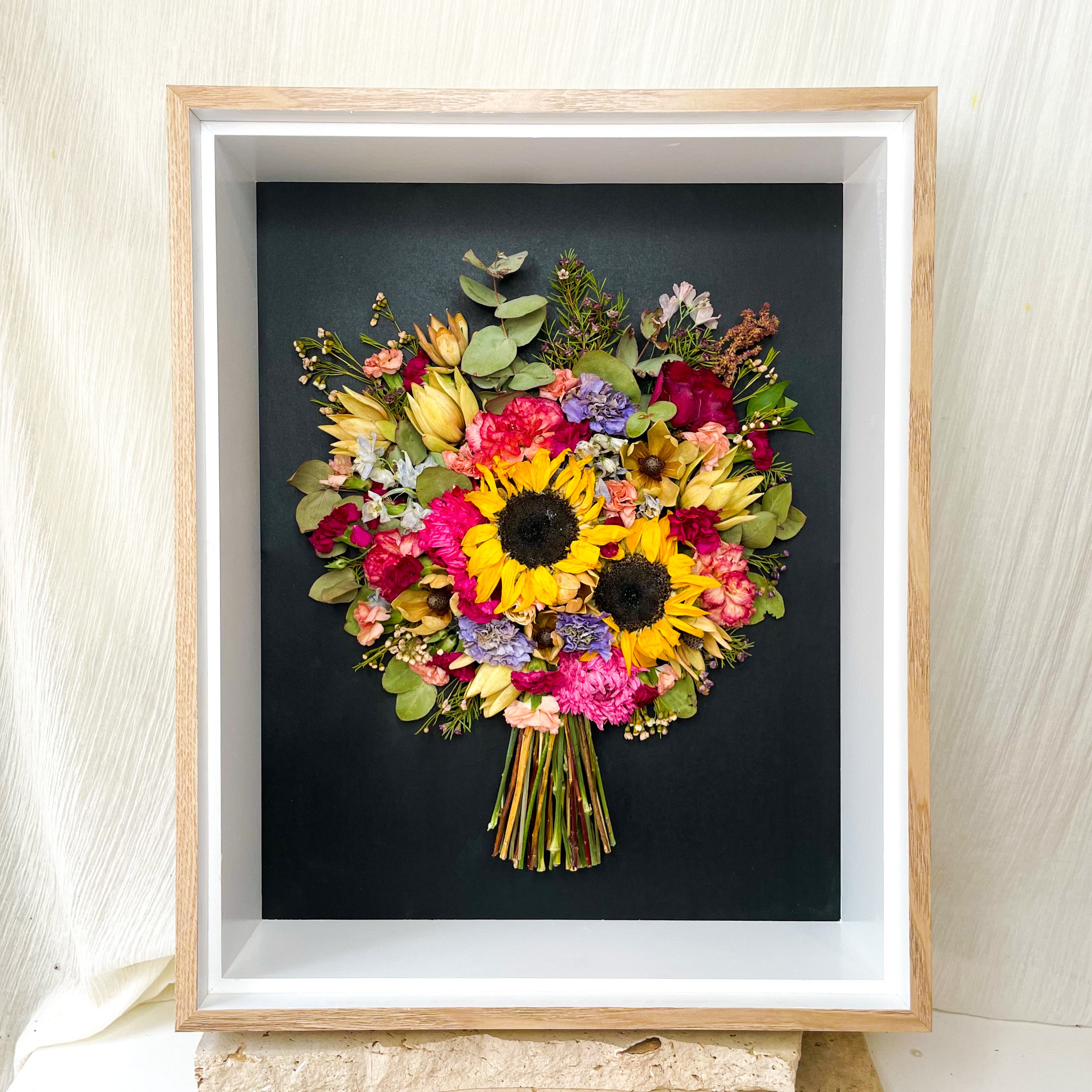 custom-flower-framing-3d-shadow-box
Preserved sunflower, red rose and native wedding bouquet set in 40x50cm 3d oak frame