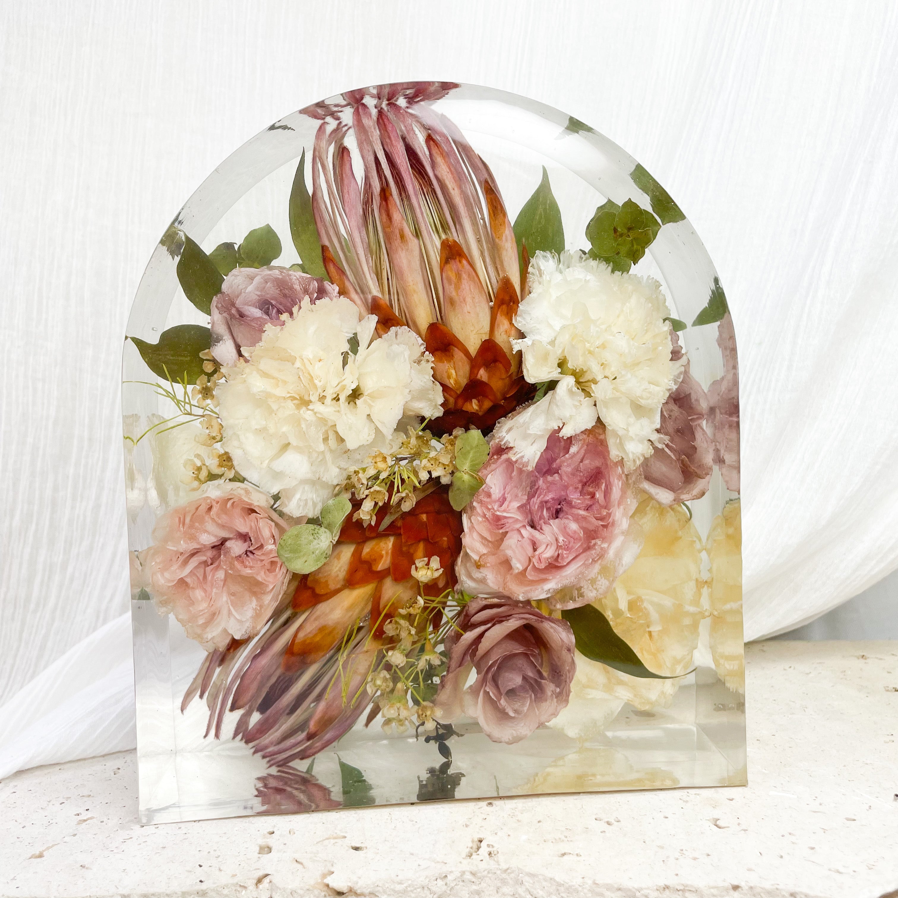 Native preserved wedding bouquet in large resin arch block