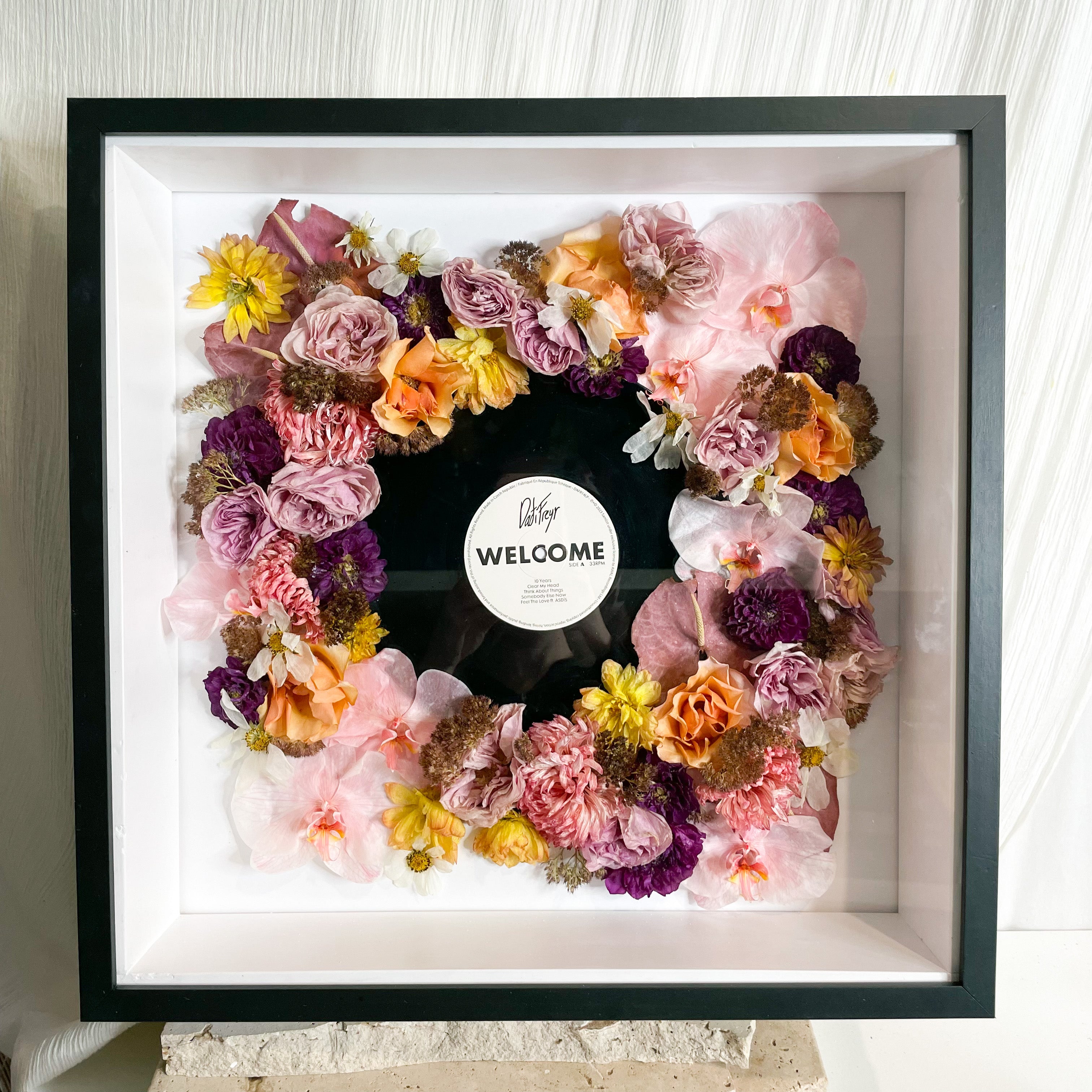 custom-flower-framing-3d-shadow-box
Preserved pink and yellow wedding bouquet set in 50x50cm black 3d frame with wedding song record