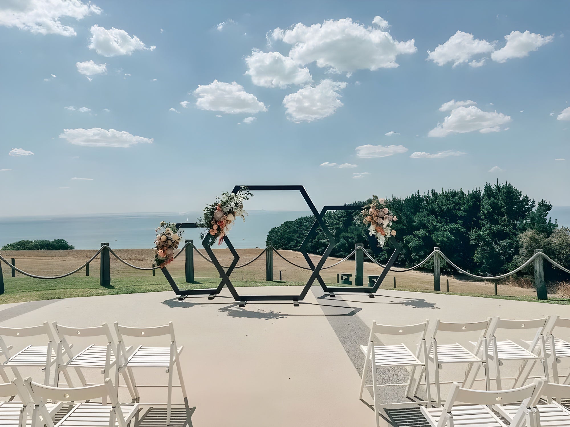hexagonal floral backdrop hired for seaside wedding